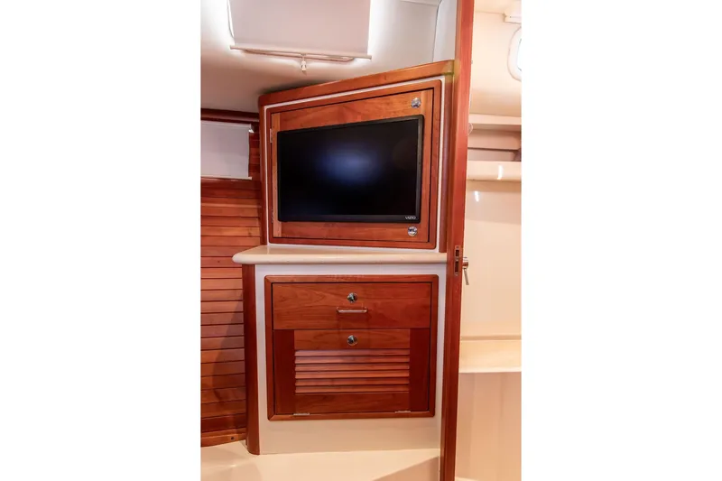 Goombay Yacht Photos Pics 2018 MJM 43z yacht interior with wooden cabinetry and built-in TV.