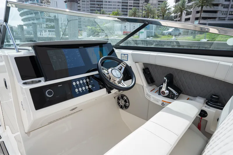  Yacht Photos Pics 2023 Sea Ray 350 Sundancer helm with modern controls and navigation displays.