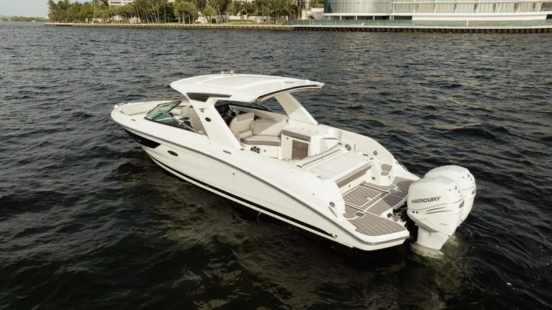  Yacht Photos Pics 2023 Sea Ray 350 Sundancer boat cruising on open water.