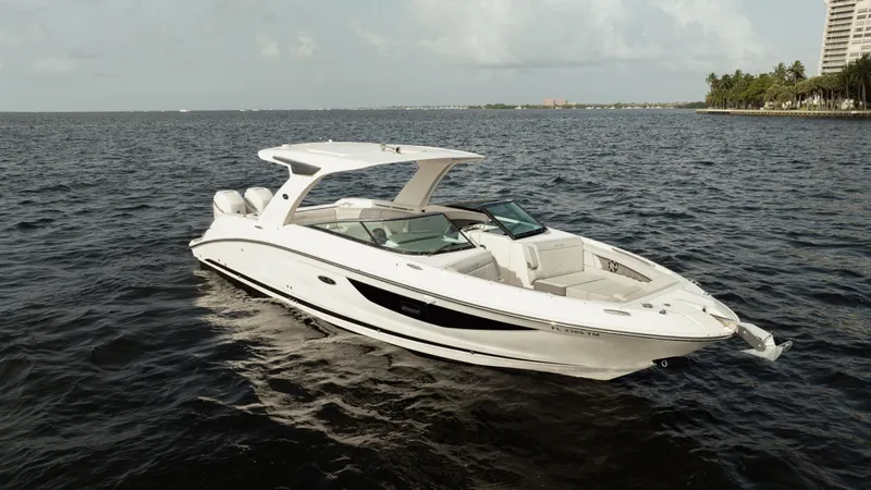  Yacht Photos Pics 2023 Sea Ray 350 Sundancer yacht on open water, showcasing sleek design and luxury features.