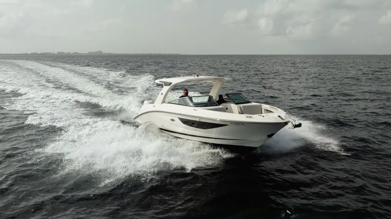  Yacht Photos Pics 2023 Sea Ray 350 Sundancer cruising on open water, creating a dynamic wake.
