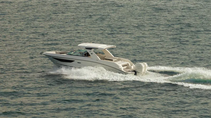  Yacht Photos Pics 2023 Sea Ray 350 Sundancer cruising on open water.