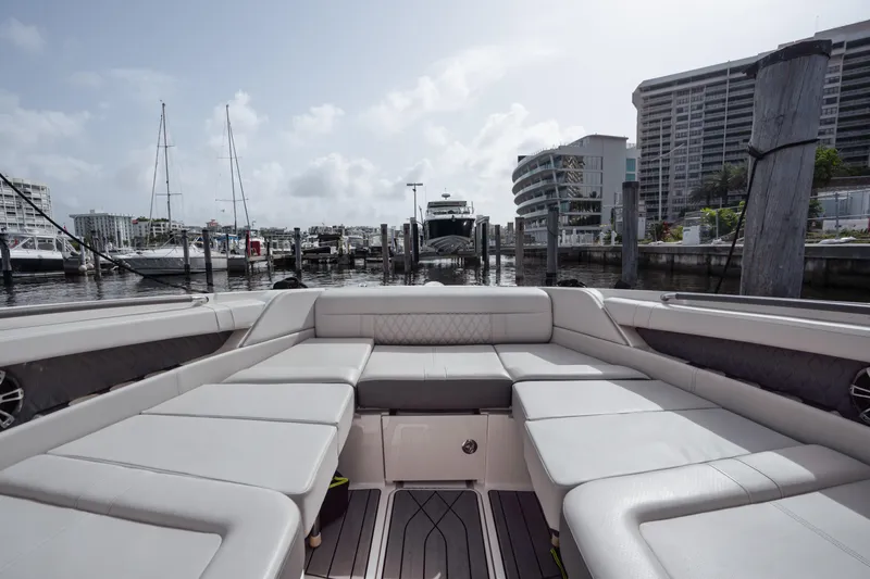  Yacht Photos Pics 2023 Sea Ray 350 Sundancer yacht interior with luxurious seating at a marina.