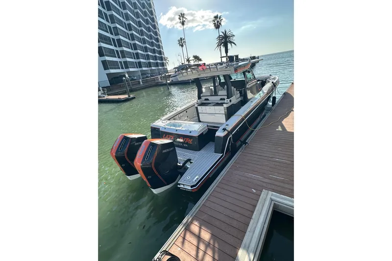  Yacht Photos Pics 2024 Formula 387 Center Console Fish docked by waterfront with twin Mercury engines.