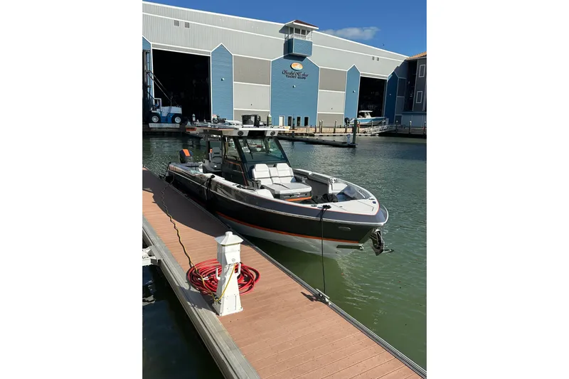  Yacht Photos Pics 2024 Formula 387 Center Console Fish boat docked at marina, sunny day.