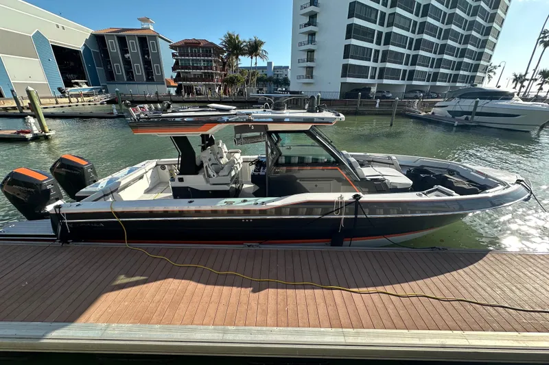  Yacht Photos Pics 2024 Formula 387 Center Console Fish boat docked in marina, featuring sleek design and powerful engines.