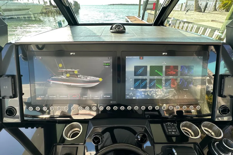  Yacht Photos Pics 2024 Formula 387 Center Console Fish dashboard with dual touchscreen displays and navigation controls.
