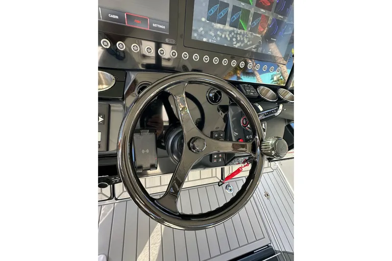  Yacht Photos Pics Steering wheel and dashboard of 2024 Formula 387 Center Console Fish boat.