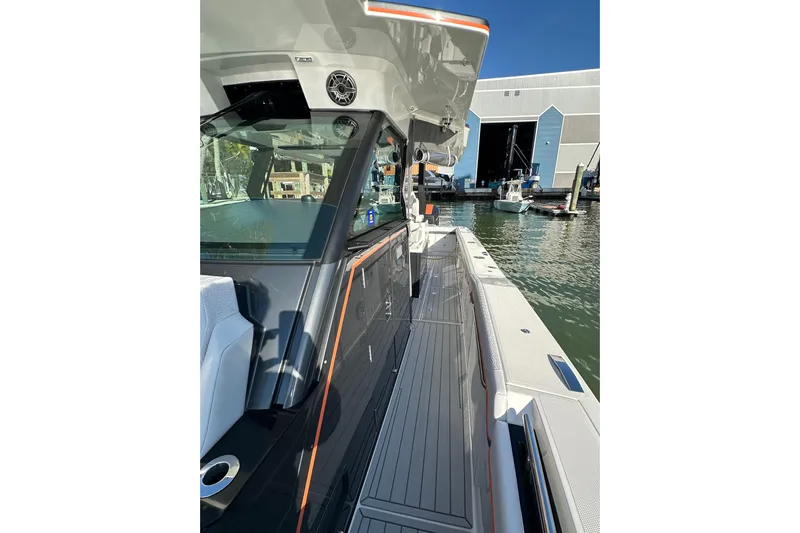  Yacht Photos Pics 2024 Formula 387 Center Console Fish boat docked near a marina, showcasing sleek design.