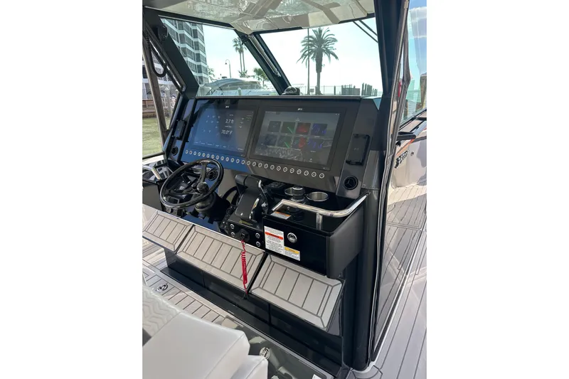  Yacht Photos Pics 2024 Formula 387 Center Console Fish dashboard with advanced navigation screens and controls.