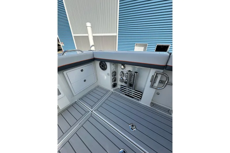  Yacht Photos Pics 2024 Formula 387 Center Console Fish boat interior with storage and control panel.