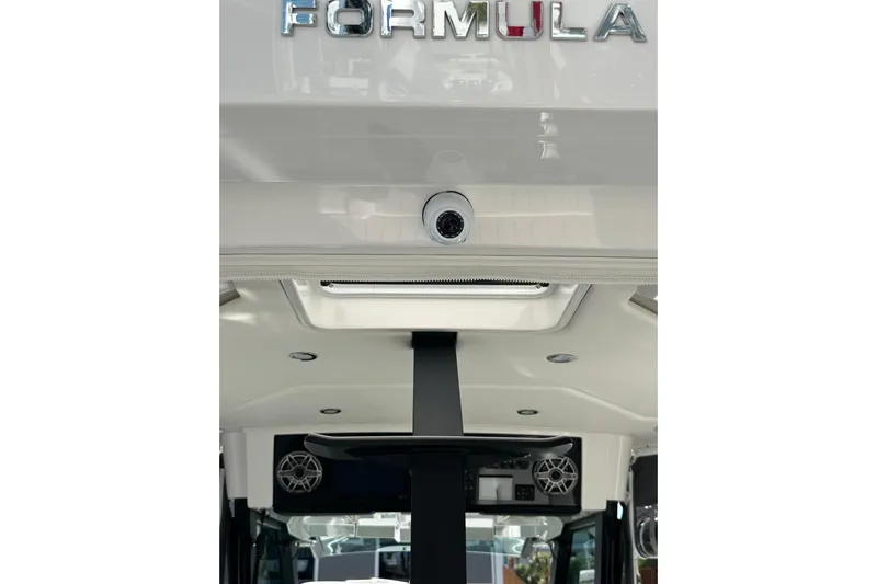  Yacht Photos Pics 2024 Formula 387 Center Console Fish boat interior with speakers and sleek design.