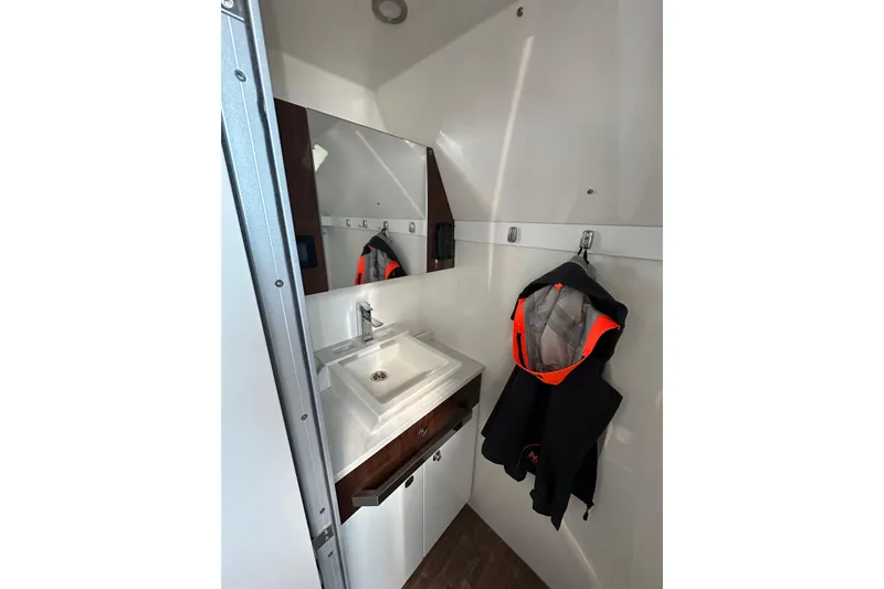  Yacht Photos Pics 2024 Formula 387 Center Console Fish interior with sink and hanging jacket.