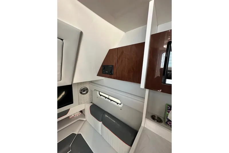  Yacht Photos Pics 2024 Formula 387 Center Console Fish cabin interior with modern design and wood accents.