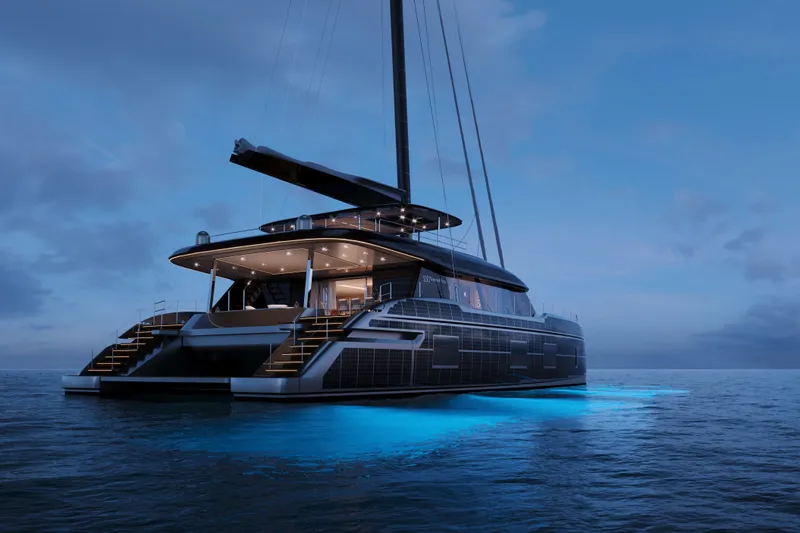  Yacht Photos Pics Luxurious 2026 Sunreef 100 yacht illuminated on calm ocean at dusk.