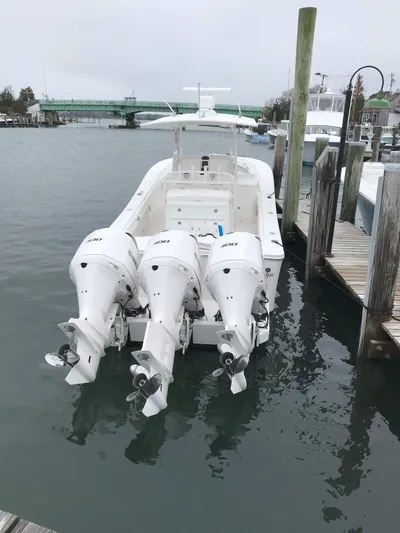Tiger Yacht Photos Pics 2017 Regulator 34SS boat with triple outboard engines docked in marina.