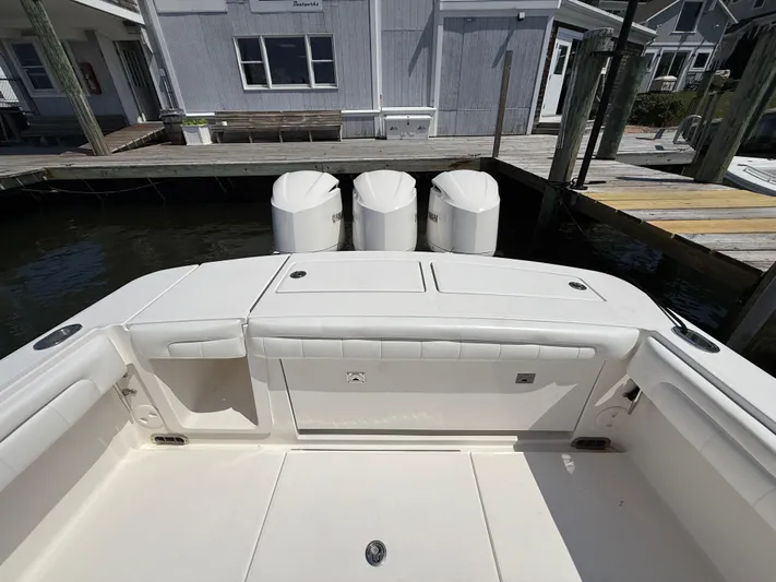 Tiger Yacht Photos Pics 2017 Regulator 34SS boat with triple outboard engines docked at marina.