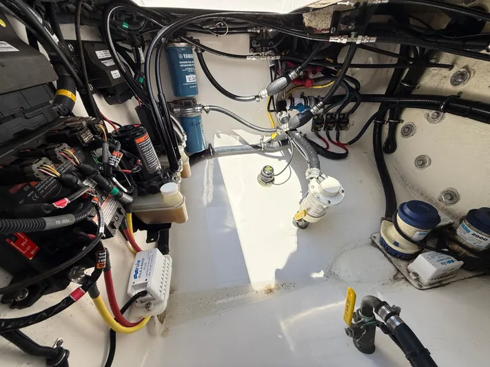 Tiger Yacht Photos Pics Engine compartment of a 2017 Regulator 34SS boat, showcasing wiring and components.