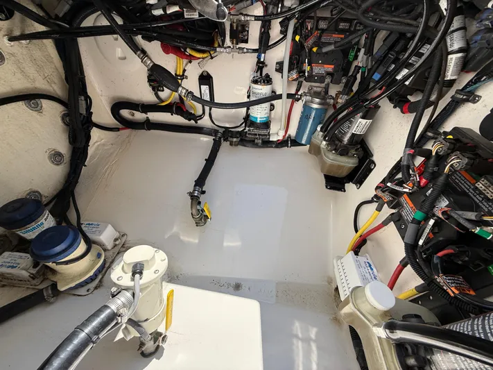 Tiger Yacht Photos Pics Engine compartment of a 2017 Regulator 34SS boat, showcasing wiring and mechanical components.