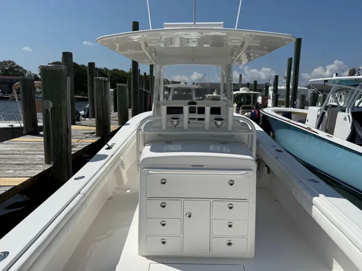 Tiger Yacht Photos Pics 2017 Regulator 34SS boat docked, featuring spacious deck and storage compartments.