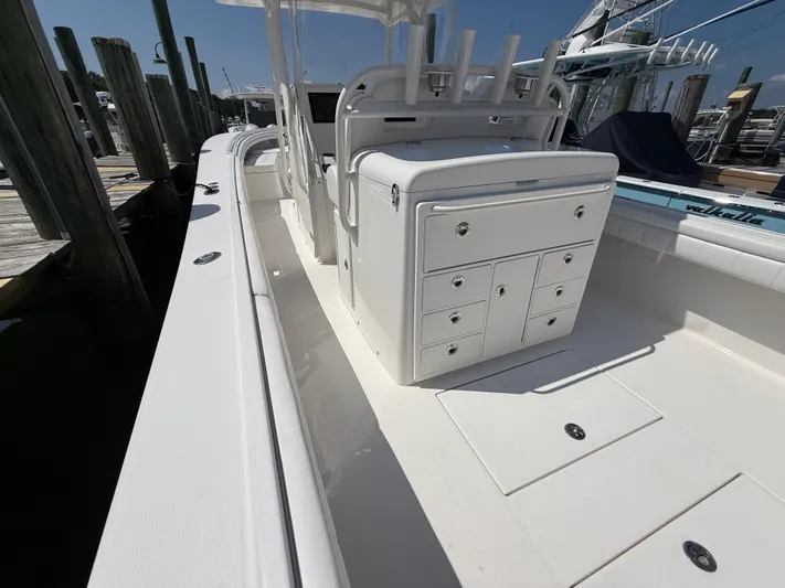Tiger Yacht Photos Pics 2017 Regulator 34SS boat interior with storage compartments and rod holders at dock.