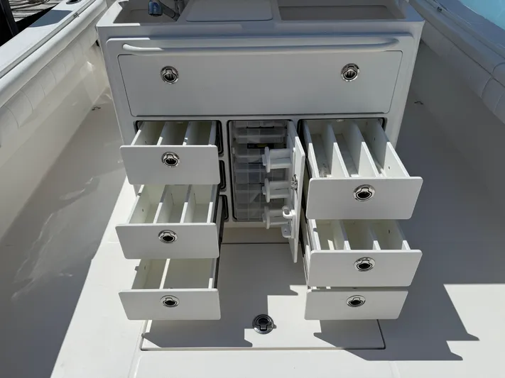 Tiger Yacht Photos Pics 2017 Regulator 34SS boat storage drawers open, showcasing organized compartments.