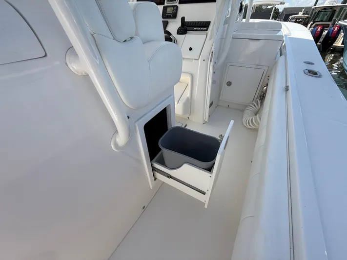 Tiger Yacht Photos Pics 2017 Regulator 34SS boat interior with open storage drawer and seating.