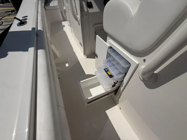 Tiger Yacht Photos Pics 2017 Regulator 34SS boat with open storage compartment and tackle boxes.