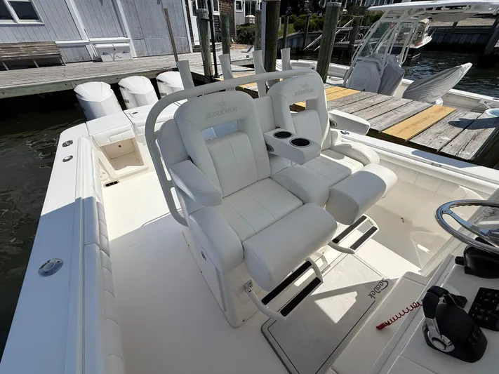 Tiger Yacht Photos Pics 2017 Regulator 34SS boat with white seating and dual cup holders at dock.