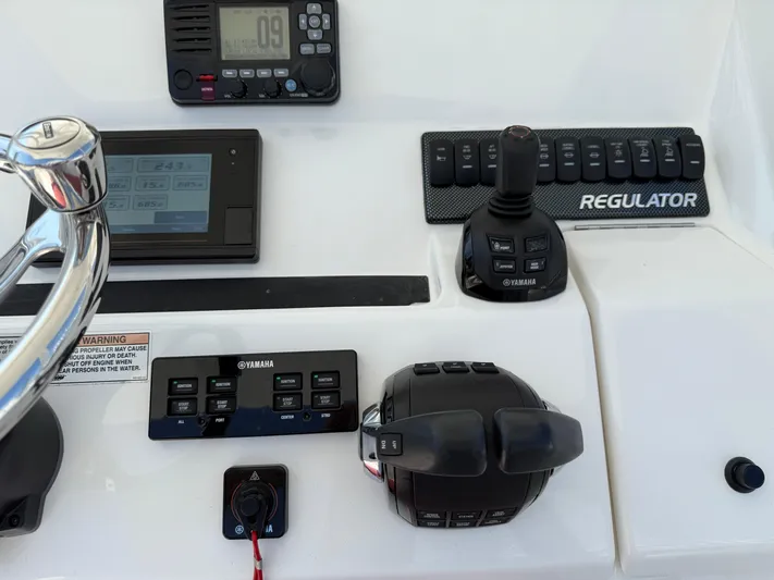 Tiger Yacht Photos Pics Control panel of a 2017 Regulator 34SS boat with Yamaha controls and joystick.