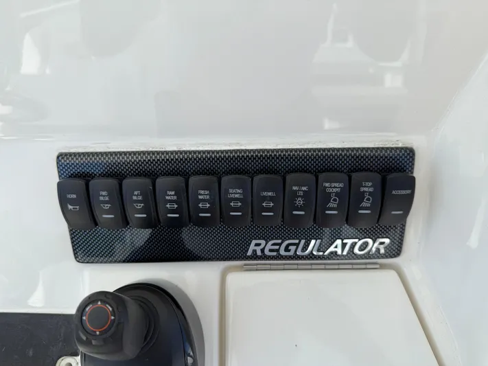 Tiger Yacht Photos Pics Control panel of a 2017 Regulator 34SS boat with labeled switches.