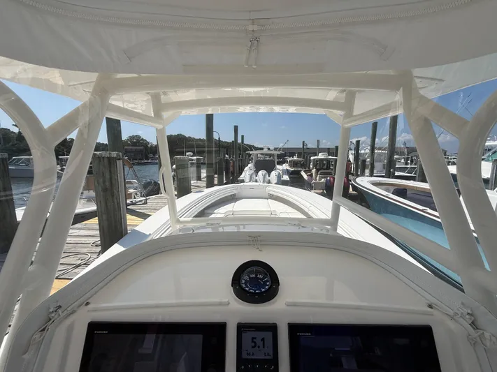 Tiger Yacht Photos Pics 2017 Regulator 34SS boat docked at marina, view from helm.