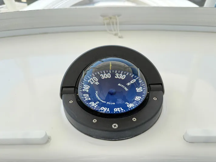 Tiger Yacht Photos Pics Compass on 2017 Regulator 34SS boat dashboard, displaying navigation directions.