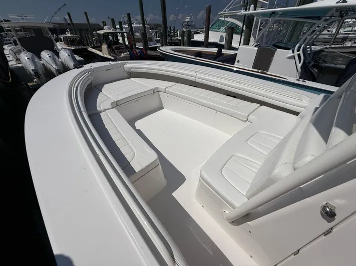 Tiger Yacht Photos Pics 2017 Regulator 34SS boat with spacious white seating area at dock.