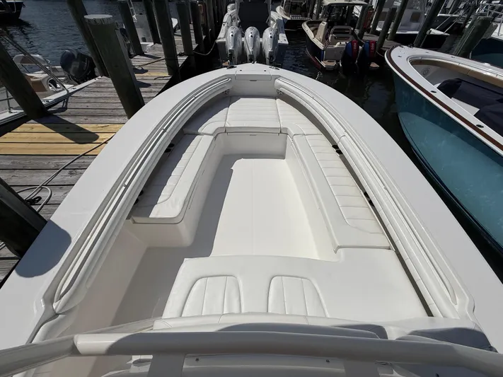 Tiger Yacht Photos Pics 2017 Regulator 34SS boat with spacious seating, docked at a marina.