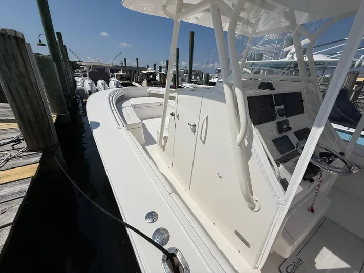 Tiger Yacht Photos Pics 2017 Regulator 34SS boat docked, featuring a sleek console and spacious deck.