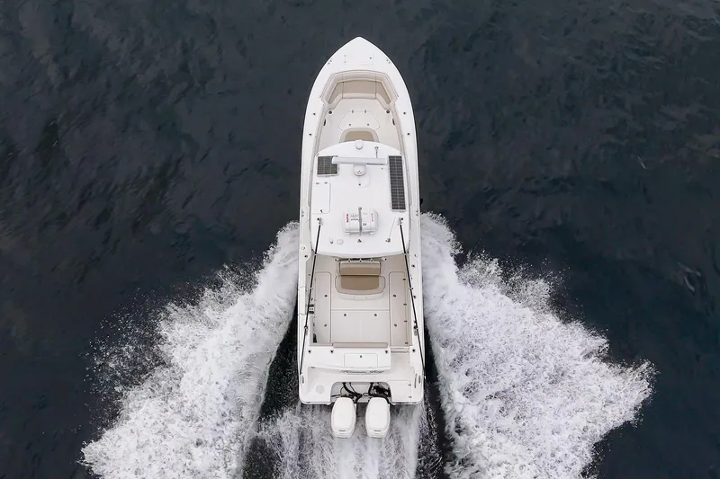  Yacht Photos Pics Aerial view of 2019 Boston Whaler 330 Outrage cruising on open water.