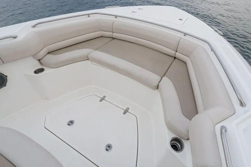  Yacht Photos Pics 2019 Boston Whaler 330 Outrage boat with spacious seating area and sleek design.
