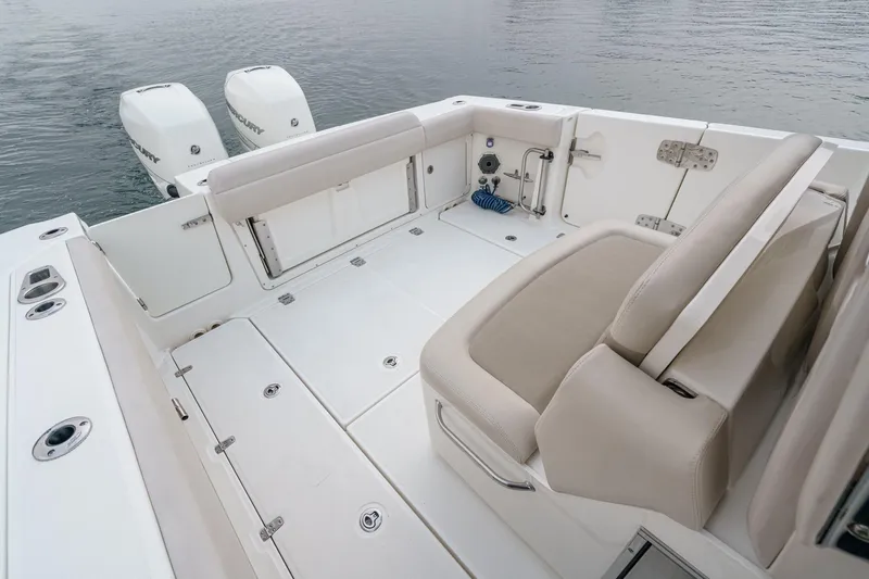  Yacht Photos Pics 2019 Boston Whaler 330 Outrage boat deck with seating and twin engines.