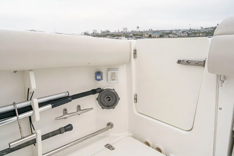  Yacht Photos Pics 2019 Boston Whaler 330 Outrage boat interior with rod holders and speaker.