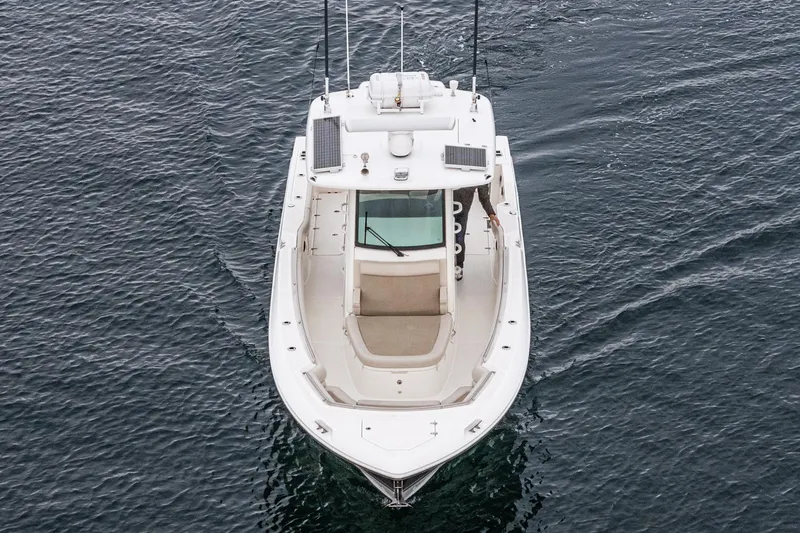  Yacht Photos Pics 2019 Boston Whaler 330 Outrage boat on open water, aerial view.