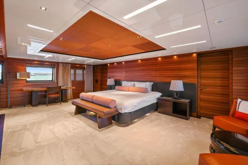 Magna Grecia Yacht Photos Pics Luxurious yacht bedroom with wood paneling, modern decor, and elegant lighting, Elsflether Werft AG 1986.
