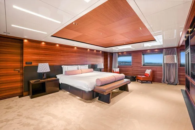Magna Grecia Yacht Photos Pics Luxurious yacht bedroom with wood paneling, modern decor, and ocean views, Elsflether Werft AG Custom 1986.
