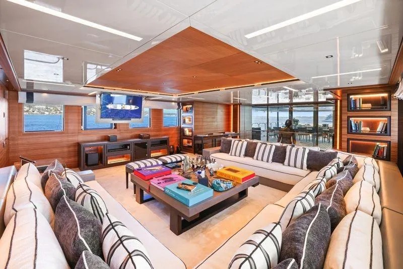 Magna Grecia Yacht Photos Pics Luxurious yacht interior with modern decor, spacious seating, and ocean views, Elsflether Werft AG Custom 1986.