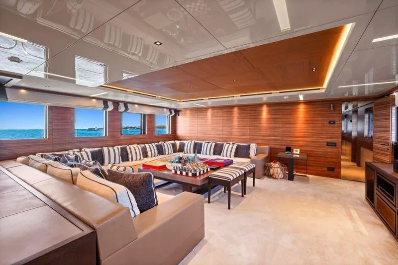 Magna Grecia Yacht Photos Pics Luxurious yacht interior with elegant seating, wooden accents, and ocean view, Elsflether Werft AG, 1986.