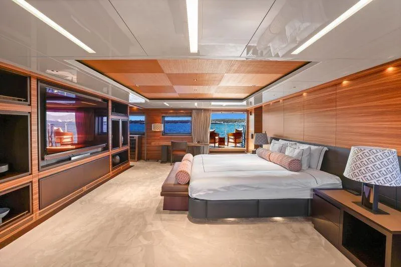 Magna Grecia Yacht Photos Pics Luxurious yacht bedroom interior with modern design, featuring a large bed and ocean view. Elsflether Werft AG, 1986.