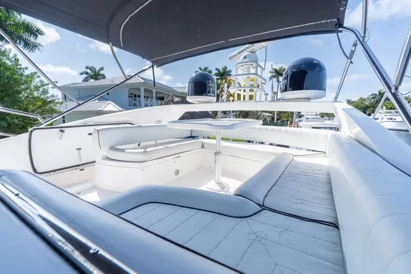 Currency Yacht Photos Pics Luxurious 2009 Sunseeker Manhattan 60 yacht with spacious outdoor seating area.