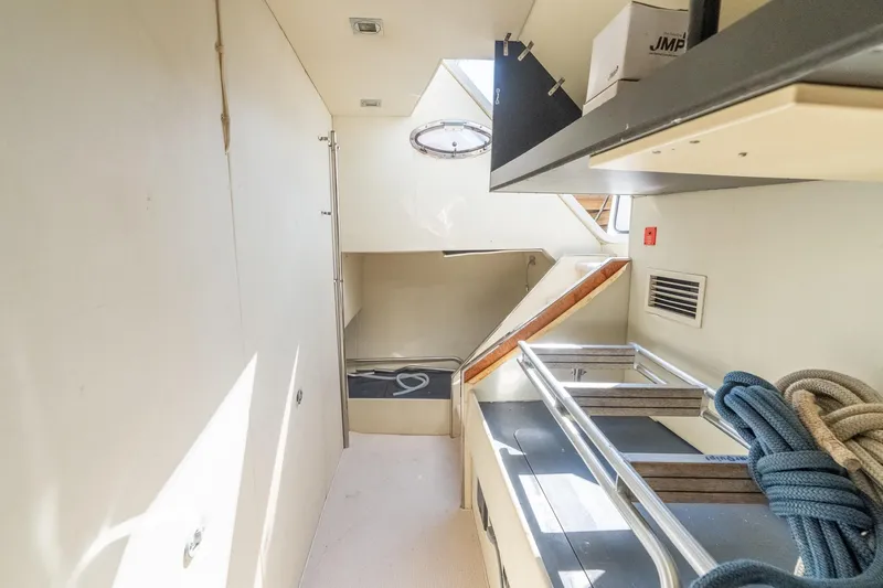 Currency Yacht Photos Pics Interior of 2009 Sunseeker Manhattan 60 yacht, featuring storage and nautical ropes.