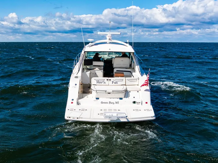 Hav-n Fun Yacht Photos Pics 2009 Sea Ray 470 Sundancer yacht cruising on open water under a blue sky.