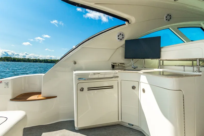 Hav-n Fun Yacht Photos Pics Luxurious interior of 2009 Sea Ray 470 Sundancer yacht with sleek cabinetry and scenic water view.